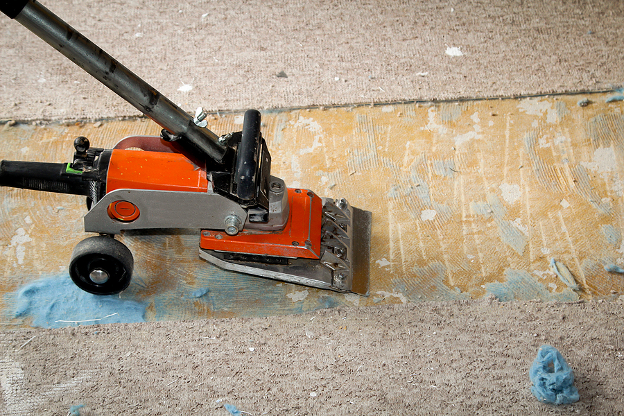 What Is the Best Way to Remove Adhesive Residue From Concrete Before Coating?